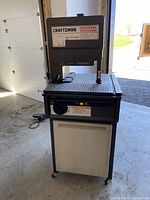 Front view of the Craftsman Professional band saw on its rolling stand