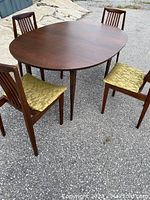 Full set view: oval table with four chairs