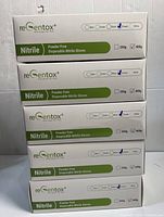 Stack of five white and green boxes, labeled ReGentox Powder Free Disposable Nitrile Gloves, purple color marked, each 350g-400g.
