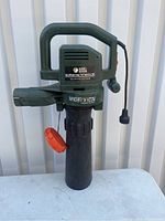 Full view of Black & Decker blower/vacuum device showing handle, tubing, and orange pull cord.