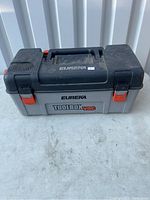 Closed view of Eureka Toolbox Vacuum showing gray and black plastic body with orange latches on white background.