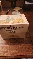 Original box of Beatrix Potter Collection Part II, volumes 13 to 23, illustrated with characters from the series on lid.