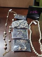 Full lot of pearl jewelry by Park Lane including three necklaces and three pairs of earrings, all in original packaging or with tags.