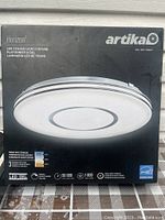 Front of the Artika Horizon LED ceiling fixture box showing product image and details.