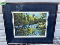 Framed print showing the entire artwork with dark blue mat and brown frame.