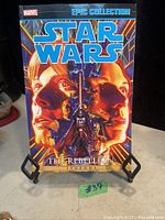 Front cover of the 2016 Star Wars Epic Collection comic titled The Rebellion featuring illustrations of Luke Skywalker, Princess Leia, and Darth Vader.