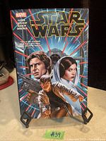 Colorful cover of 2016 Marvel Star Wars comic book showing Han Solo, Princess Leia, and Luke Skywalker with starship background.