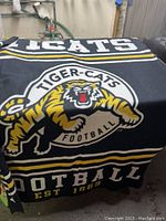 Front view of the Tiger-Cats blanket showing the tiger logo with football and text.