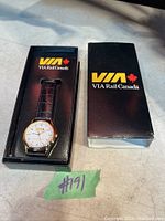 Image of the VIA Rail Canada Millennium watch inside its black presentation box featuring the VIA Rail Canada logo.