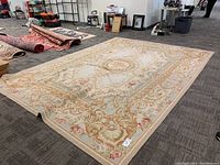 Full view of rug laid flat on floor showing overall pattern and size.