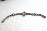 Full view of the vintage sterling rhinestone bracelet showing overall length, design flow, and clasp.