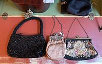 Photo of all three vintage purses together showing different shapes and materials.