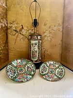 Photo showing Rose Medallion ceramic lamp base and two decorated ceramic dishes.