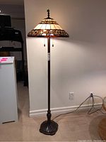 Full view of lamp showing shade, column and base