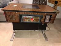 Full front view of cocktail arcade cabinet