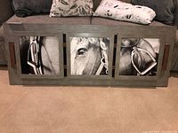 Front view of the horse-themed wall art panel with three black and white horse detail images in a gray wood frame.