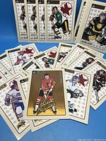 View of multiple hockey cards mostly CHL Future Stars with players in various team uniforms on white and beige star patterned backgrounds.