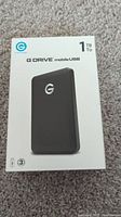Box of the G Drive Mobile USB external hard drive showing the front with brand, model, and 1TB capacity.