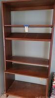 Front view of entire bookcase showing all shelves and overall design