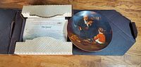 Collector plate 'The Tycoon' by Knowles Norman Rockwell, showing front artwork and certificate of authenticity inside box.