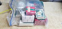 Photo of large sealed bag containing multiple boxed Christmas ornaments