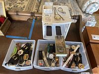 View of multiple wristwatches laid out in trays showing character watches and various bands