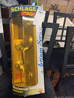 Front view of Schlage door handleset in original packaging showing full handleset with label and branding.