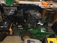 Left-side view showing engine, deck, and wheels