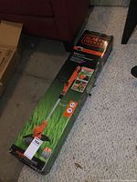 Full view of Black & Decker EasyFeed corded string trimmer box, showing product image and branding.