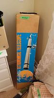 Tall original box showing Aerolite Astronomical Telescope branding and image of telescope with moon surface graphic.
