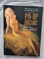 Front cover showing illustrated pin-up art of a blonde woman in a yellow dress.