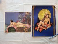 Both vintage calendar tops displayed together, showing the full artwork and condition with visible wear.