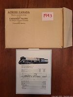 Original aged envelope labeled 'Across Canada 1943' with a souvenir locomotive information sheet beneath it showing a colored photo and technical drawings/specs of a train locomotive.