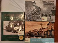 Three vintage pictorial history books about British Columbia arranged together showing front covers.