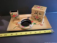 Full set displayed on a dark surface with measuring tape showing approx. 10 inches wide tray.