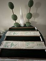 Boxes of floral wire on dark table, labeled Southern Steel & Wire Inc. and Highland Wire Inc.