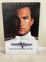Full view of the mounted Steven Seagal 'Under Siege' movie poster 27x40 inches.