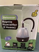 Box showing Betazooer reptile humidifier with 2 hoses, 2.5L capacity, adjustable humidity, auto shut-off, flexible hoses.