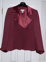Front view of Sunny Choi women's suit jacket in burgundy with satin textured collar and cuffs