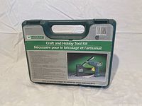 Closed green Mastercraft branded carrying case with label describing the Craft and Hobby Tool Kit