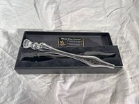 Glass whiskey water dropper in black box with velvet lining, showing the clear elongated dropper detail.