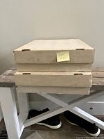 Two closed large cardboard hobby boxes stacked on top of each other.