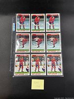 Nine 1977 Topps Guy Lafleur hockey cards displayed in a plastic sleeve, front side showing player images in red uniform.