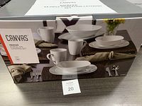 Photo of the boxed Canvas Mercer 34 piece porcelain catering set showing the brand and product name.