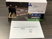 Box of Mainstays Lattice Pathway Light Set 6-pack, showing product image and branding