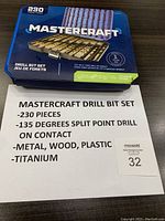 Closed blue plastic carrying case with Mastercraft branding and product details including 230 pieces, 135-degree split point, and titanium coating.