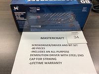 Box and advertising label showing 80-piece screwdriver and bit set with details and warranty info.