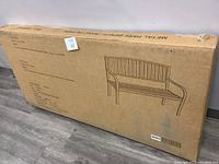 Exterior of cardboard box with printed bench outline and text 'Metal Park Bench'