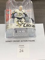 Sidney Crosby action figure in original packaging showing front view with Pittsburgh Penguins logo and NHL branding.