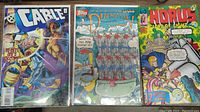 Photo of three comic books side by side showing covers: Cable #2, Duckman, and Horus Lord of Light.